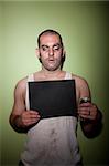 Man with crazy eye takes mugshot