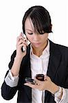 Worried business woman speaking on phone and reading SMS, closeup portrait against white background.
