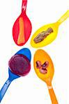 Spoon Full of Vegetables Carrots, Beets, Asparagus and Black Eyes Peas.  Isolated on White with a Clipping Path.