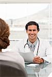 Positive doctor during a appointment with a female patient in his office