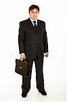 Full length portrait of young businessman holding  briefcase in hand isolated on white