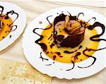 hot chocolate dessert with sweet sauce on a dish