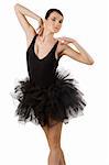 classic dancer with black dress and shoes on white background taking ballet pose