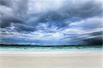 Sandy beach and dramatic sky landscape