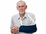 Old man with injured arm in sling after accident. Pain shows on face.  Isolated on white.