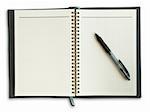 Black pen on a notebook with a grid isolate on white background