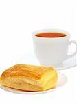 Appetizing puff with tea isolated on a white background
