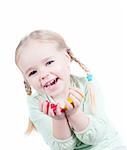Studio shot of little girl playing with colors