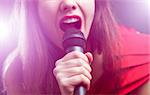 Woman sing over color background. Focused on arm.