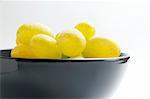 Fresh ripe  cluster of grapes  placed in ceramic bowl close up isolated on white background