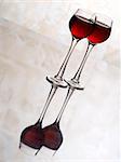 Two red wine glasses on white