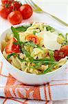 pasta salad with tomatoes and arugula in the Italian style