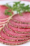 Salami with parmesan and pepper crust. Shallow dof
