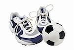 Sport shoes and soccer ball isolated on the white background