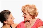 A picture of grandmother and granddaughter talking over white background