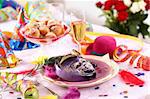 Carnival and party place setting with mask