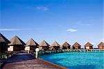 Water bungalows of hotel on the tropical island of Maldives