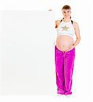 Smiling beautiful pregnant woman holding blank billboard  isolated on white