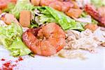 Salad with tiger shrimps and vegetable closeup