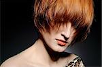 Beautiful red heaired woman portrait with fashion hairstyle from salon