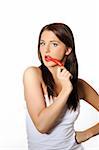 Beautiful sexy woman with red hot chilli pepper. isolated on white background. copy-space