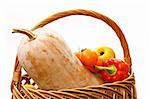 pumpkin and harvest in a basket on a white background