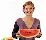 Young pretty woman with slice of watermelon on white background