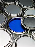 Paint cans full frame with a blue can opened