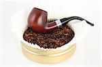 Wooden smoking pipe and tobacco