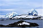 Beautiful snow-capped mountains against the blue sky in Antarctica