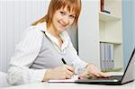 attractive young woman. Office worker with a laptop