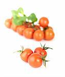 Three tomatoes-cherry on a white background