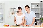 Young couple looking at the camera  at home