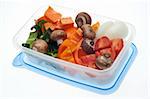 Variety of Vegetables Mushroom, Pepper, Onion, Tomato, and Sweet Potato in a Plastic Container.