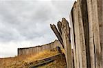 Gloomy skies over the ruins of historic palisade fortifications