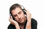 handsome man listening the music. Isolated over white background
