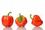 group of red peppers on white background