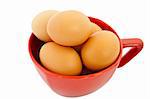 brown eggs in red bowl on white background