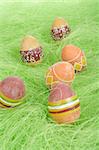 Painted brownl Easter Eggs on green Grass