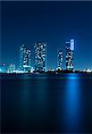 Miami skyline at night with beautiful water reflections