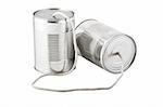 Closeup of tin cans telephone connected by string on white background, business communication concept