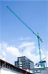 tower crane working on construction on blue sky background