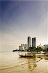 Cityscape of ship on the sea near the port.