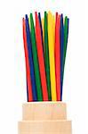 colorful mikado sticks in wood cup