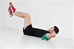 young man in fintess sport club exercise withweights and relaxing