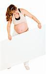 Interested pregnant woman holding blank billboard  isolated on white