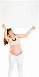 Smiling  pregnant woman holding blank billboard over her head isolated on white