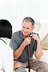 Retired man with his nurse  at home