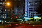 Night scene of modern city with cars motion blurred.
