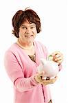 Man dressed as a woman, saving money in a piggy bank.  Isolated on white.